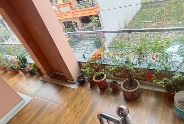 Fully furnished room for rent in Basant Vihar Gondwara Raipur with balcony, bed, wardrobe and rooftop access