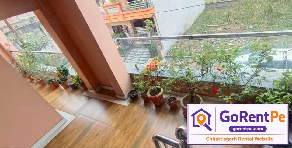 Fully furnished room for rent in Basant Vihar Gondwara Raipur with balcony, bed, wardrobe and rooftop access