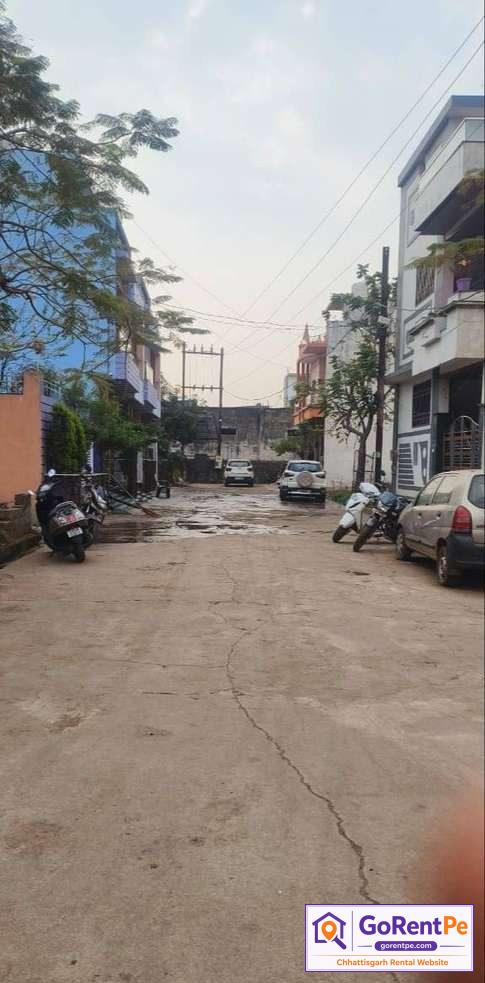 Fully furnished room for rent in Basant Vihar Gondwara Raipur with balcony, bed, wardrobe and rooftop access