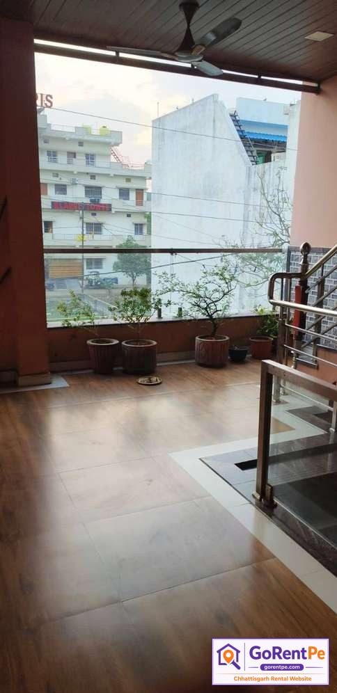 Fully furnished room for rent in Basant Vihar Gondwara Raipur with balcony, bed, wardrobe and rooftop access