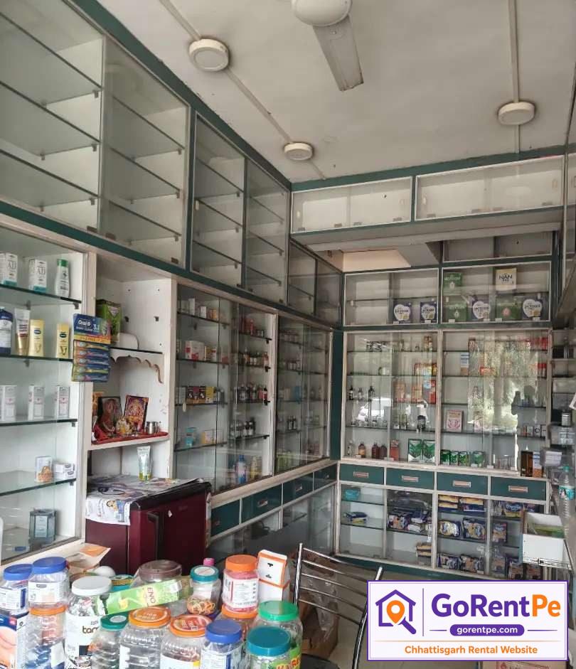 Fully furnished medical store for rent with display racks, billing counter, storage cabinets and prime commercial location