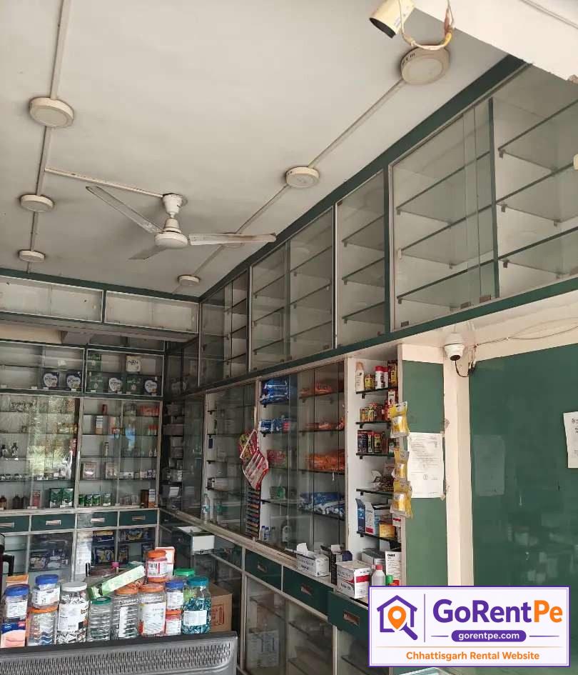 Fully furnished medical store for rent with display racks, billing counter, storage cabinets and prime commercial location